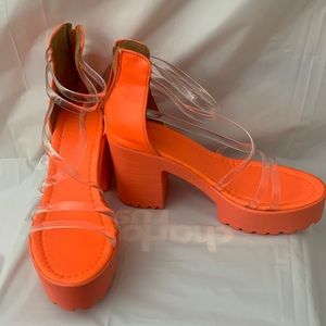 Orange heels. Never worn.
